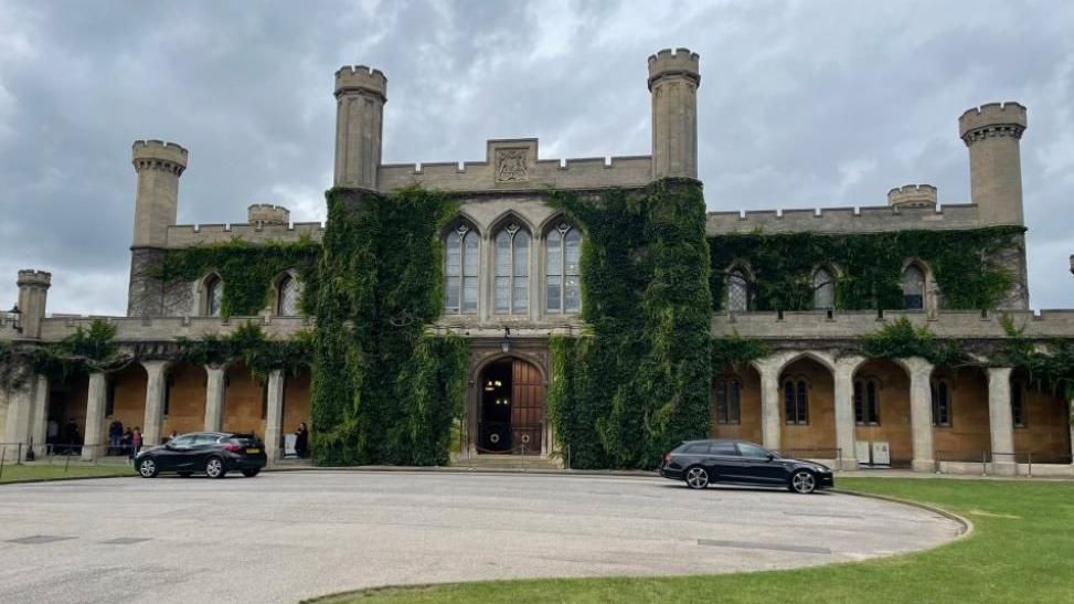 Lincoln Crown Court with turrets and columns covered in greenery