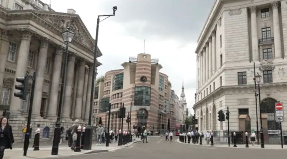 Bank junction with people walking around 