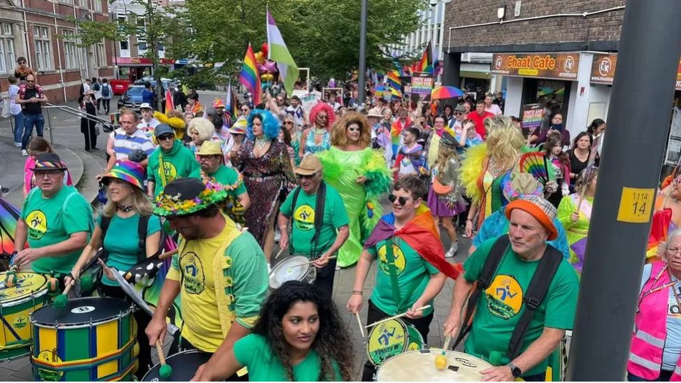 People playing samba drums at the Pride event