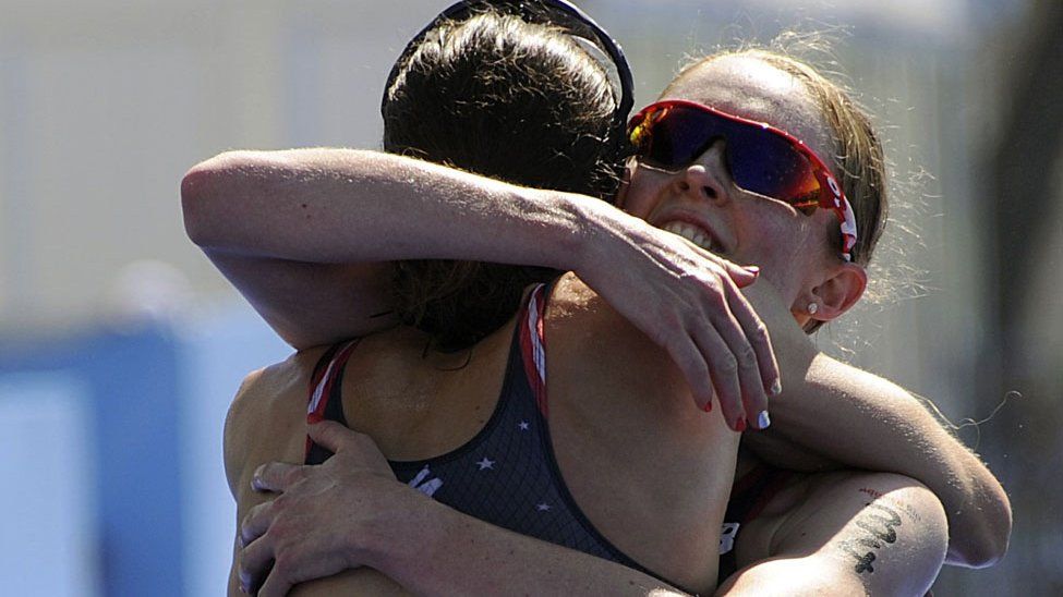 Non Stanford and race winner Gwen Jorgenson embrace after the Rio Olympic test triathlon