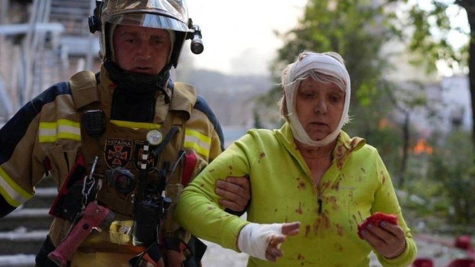 Firefighter and injured woman