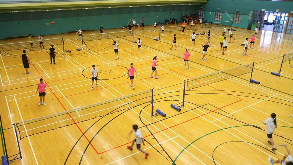 People playing badminton in badminton courts in Hong Kong