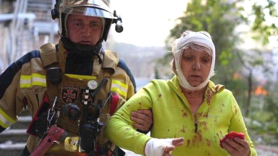 Firefighter and injured woman