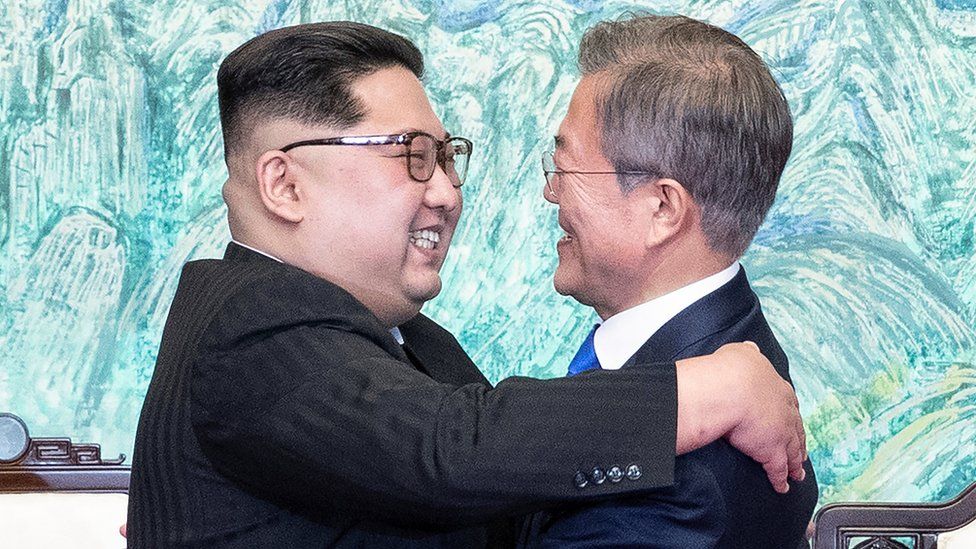 North Korean leader Kim Jong-un (left) and South Korean President Moon Jae-in embrace at the truce village of Panmunjom, South Korea, 27 April 2018