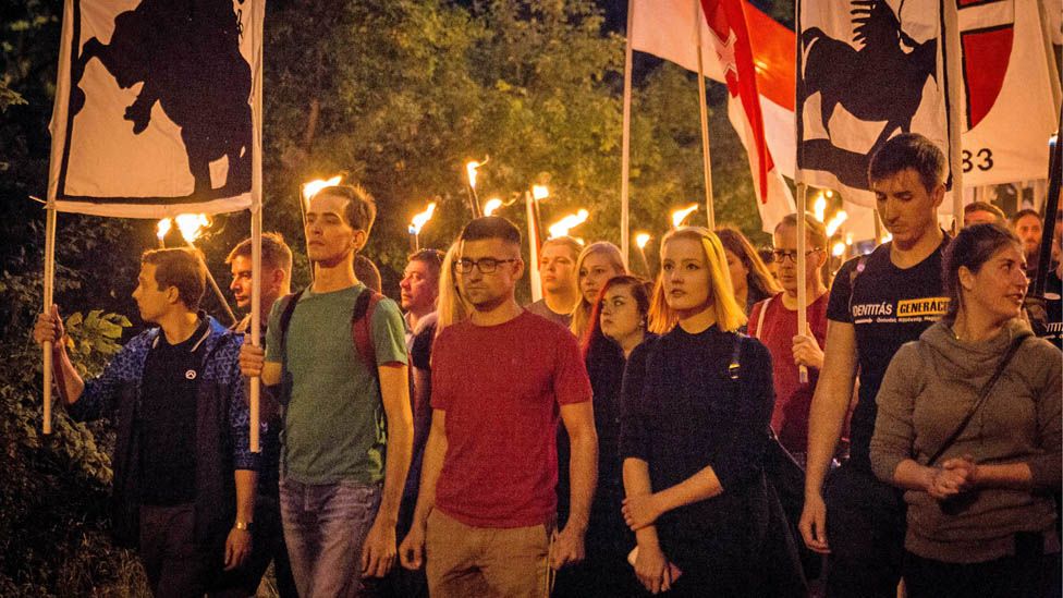 Martin Sellner (centre) on a torch-lit march near Vienna in September 2017