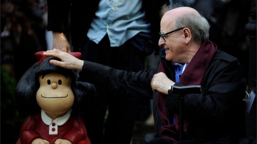 Cartoonist Joaquin Salvador Lavado, also known as Quino, touches a sculpture of his comic character Mafalda, during an opening ceremony of a park of San Francisco in Oviedo, northern Spain, October 23, 2014