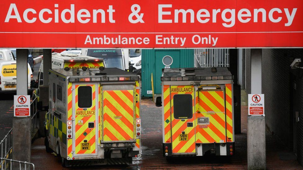 Ambulances wait at an A&E department in Glasgow
