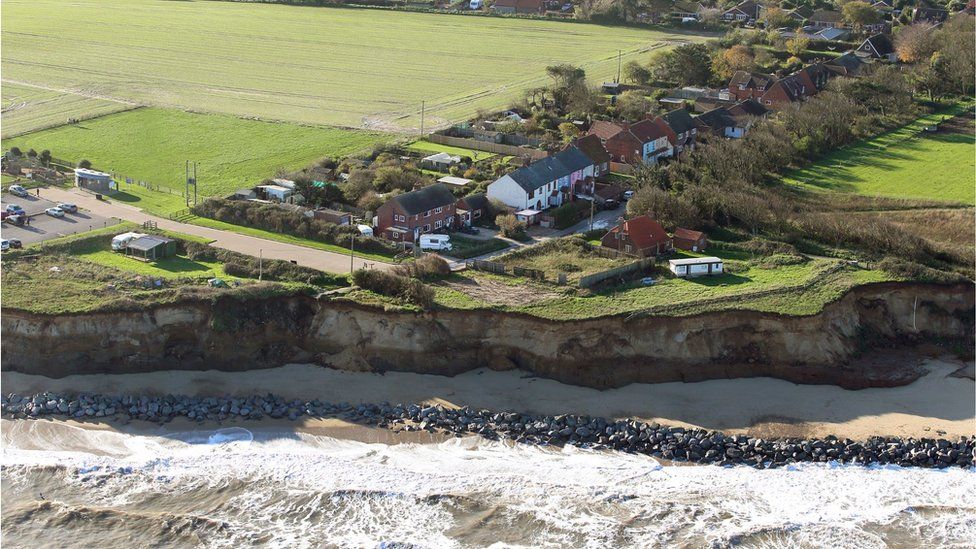 Ariel view of Homes perilously close to the cliff edge at Happisburgh, north Norfolk