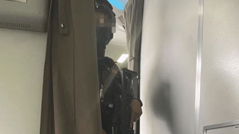 Armed officer, Kenya Airways plane