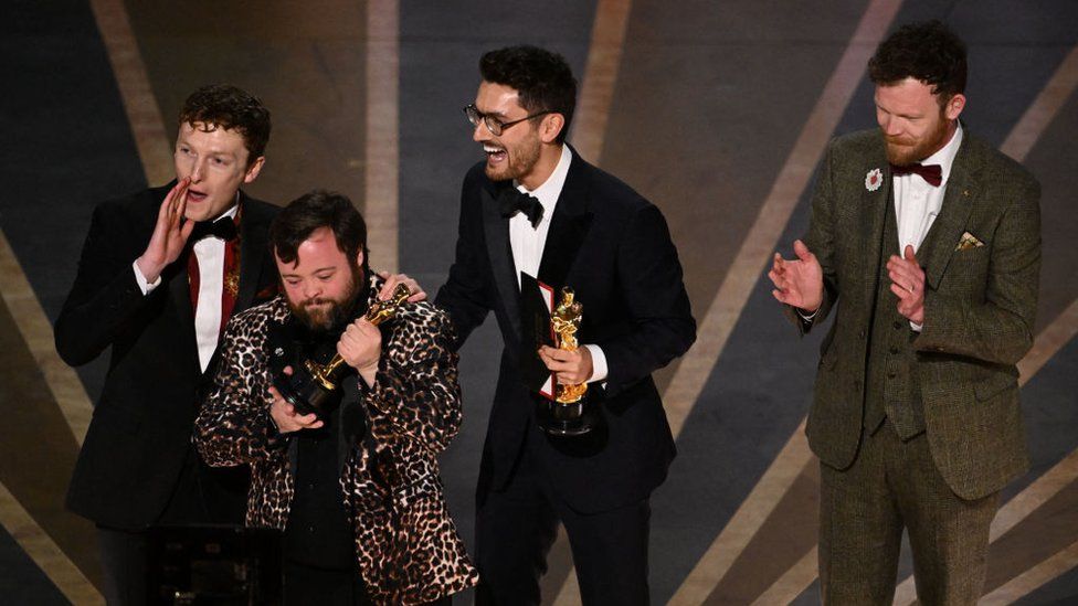 Filmmakers Ross White (left), James Martin (second left), Tom Berkeley (second right) and Seamus O'Hara on stage at the Oscar's awards ceremony