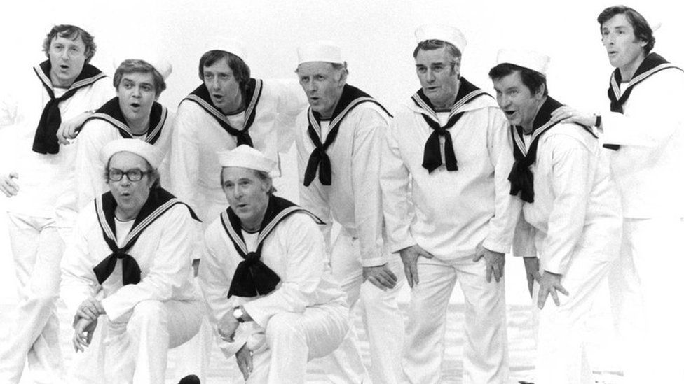 back row l-r Michael Aspel, Philip Jenkinson, Barry Norman, Frank Bough,Eddie Waring, Richard Baker and Richard Whitmore front row l-r Eric Morecambe and Ernie Wise in 'The Morecambe and Wise Christmas Show'
