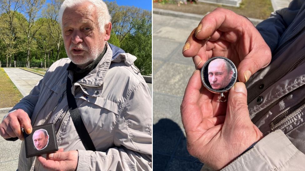 Alexander shows a cigarette holder and a tobacco box he has decorated with portraits of Vladimir Putin