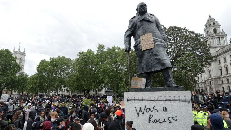 Statue of Churchill with graffiti calling him a racist