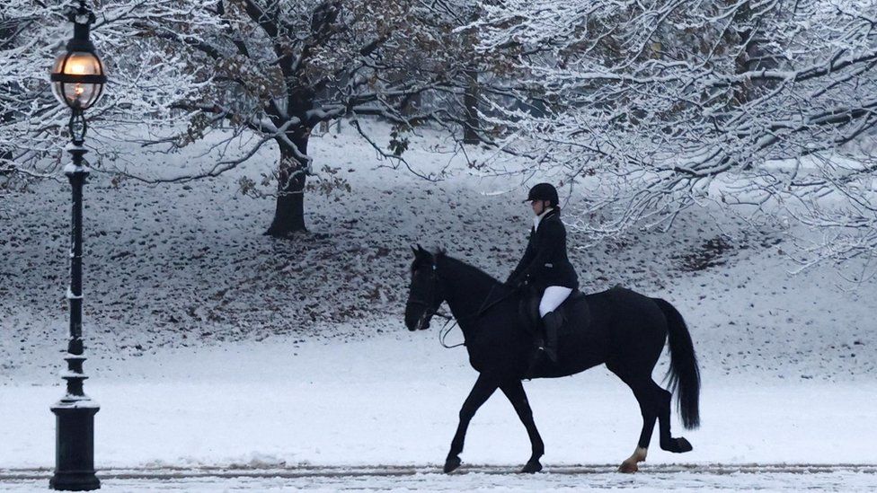 Woman riding a horse in snow
