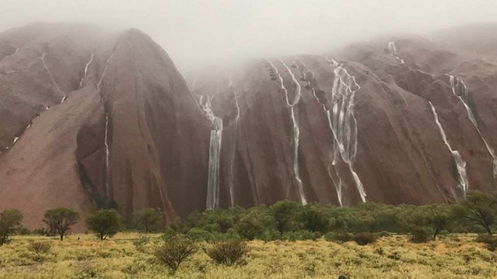 Waterfalls from Uluru after heavy rain