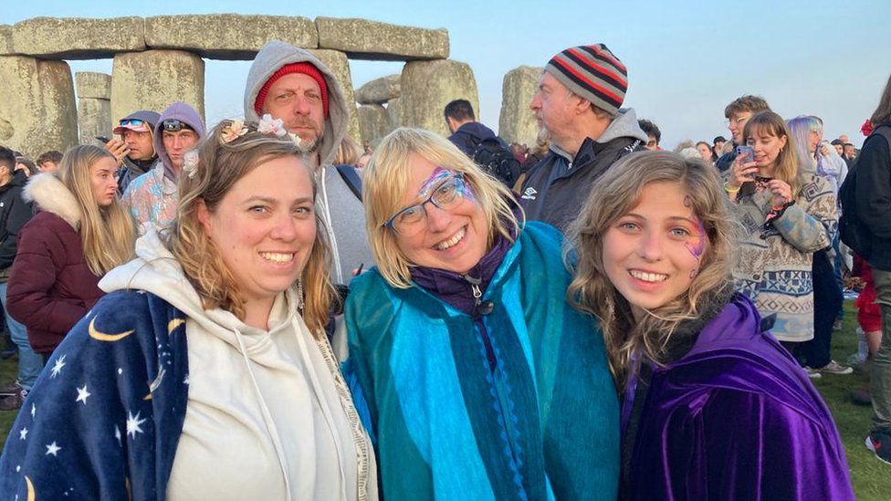 Katelyn Sanders, Carolyn Pare and Vanessa smiling in front of the stones