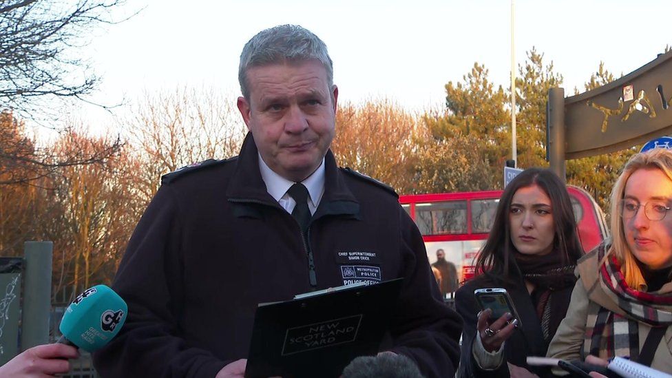 Ch Supt Crick speaking to a crowd of journalists near where the baby was found