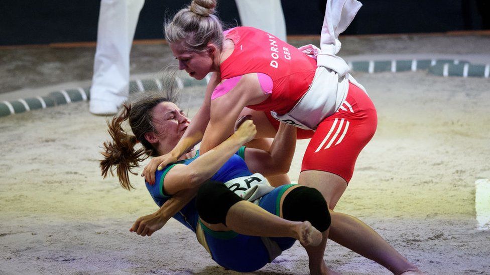 Germany's Julia Dorny, right, fights Brazil's Luciana Montogomery Higuchi during the Sumo Open Weight Women's Competition of The World Games
