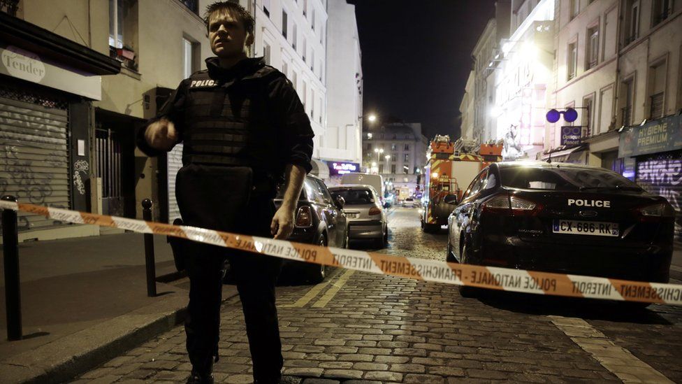 Police man and tape across street in the aftermath of the November 2015 Paris attacks