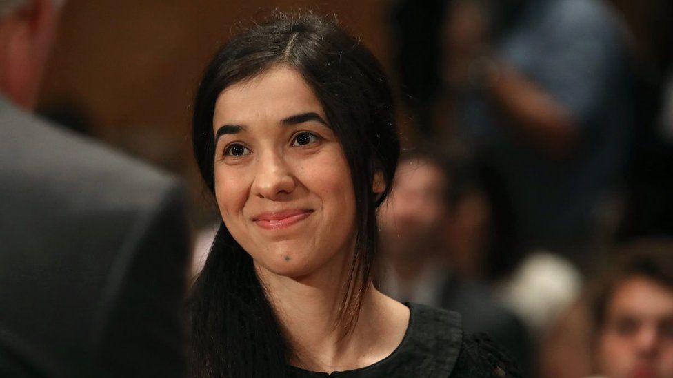 Nadia Murad, (C), human rights activist, arrives at a Senate Homeland Security and Governmental Affairs Committee hearing on Capitol Hill, June 21, 2016 in Washington, DC.