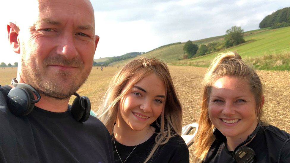 Jason Jones with daughter Ela (middle) and wife Lisa (right)