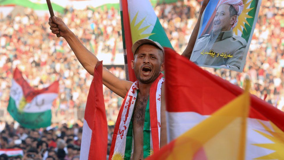 A man show his support for the Kurdish independence referendum in Zakho, Iraq (14 September 2017)
