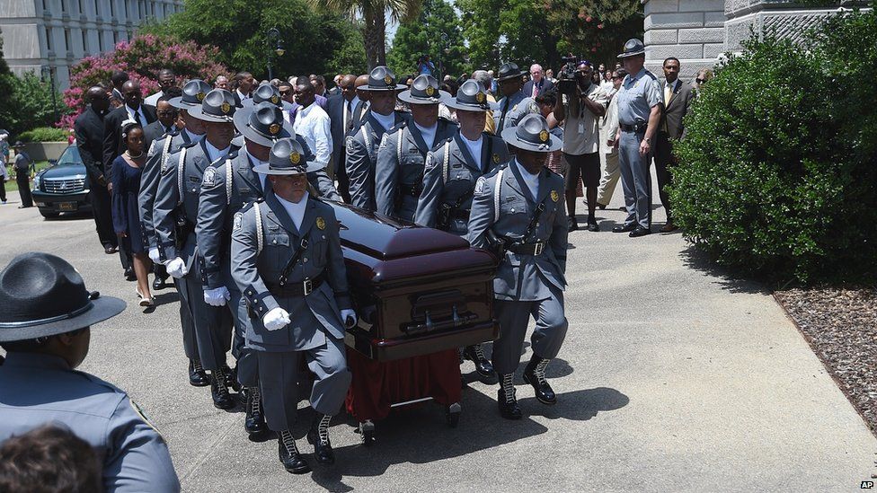 Casket being carried