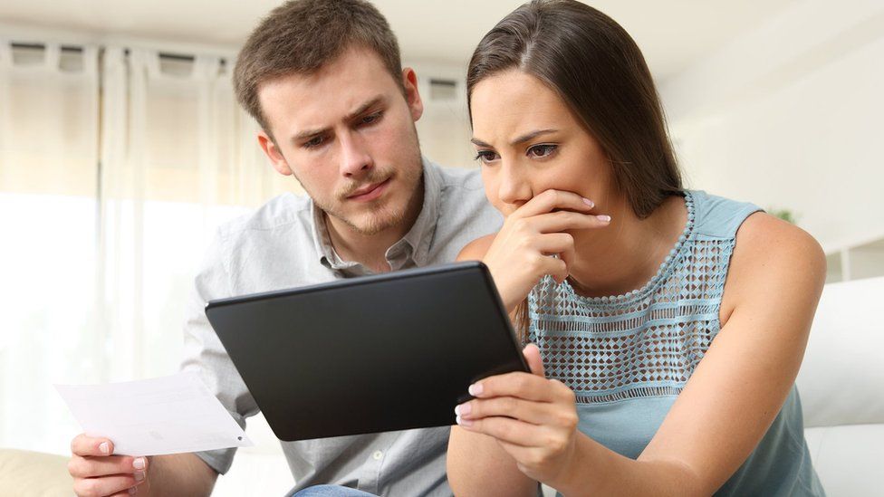 Couple looking at emails