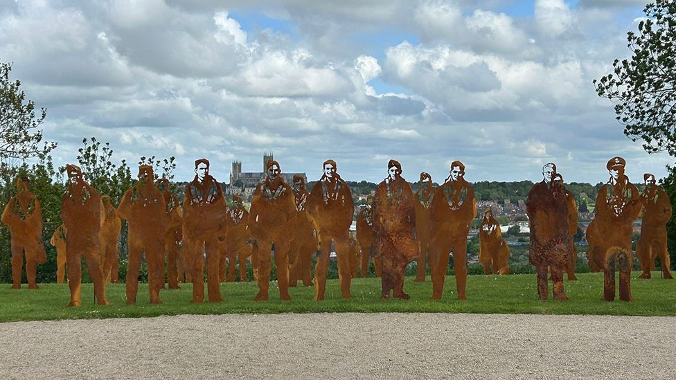 Metal silhouettes of the 53 men who lost their lives