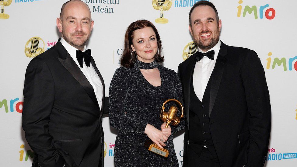 Evening Extra presenters Declan Harvey and Richard Morgan, with producer Gráinne Deeney, celebrate the team's win in the News Programme category