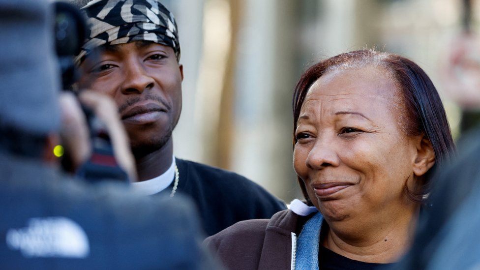 Pamela Harris, who believes her son Sergio Harris, 38, died in an early-morning shooting in a stretch of downtown near the Golden 1 Center arena, reacts next to activist Stevante Clark, near the crime scene, in Sacramento, California