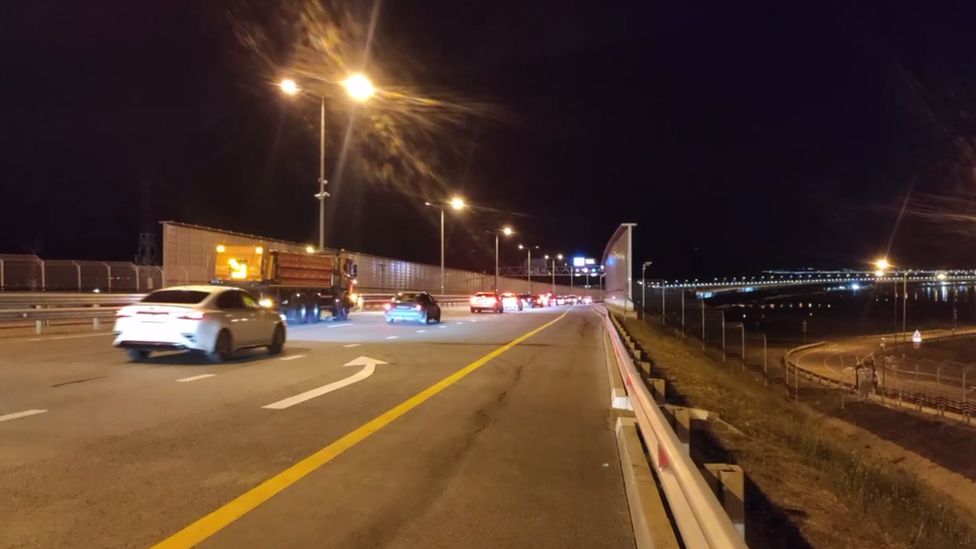 A still from a video on Deputy Prime Minister Marat Khusnullin's telegram appears to show cars crossing the Kerch bridge