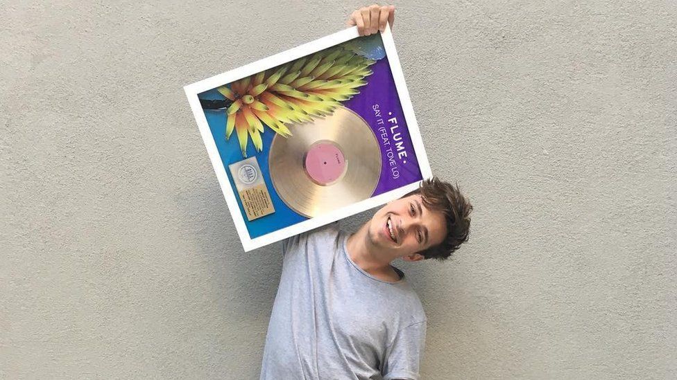 Flume - pictured with a gold disc for his record Say It, in October 2016