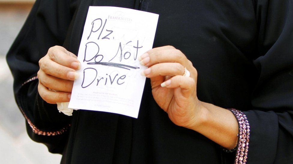 Female driver Azza Al Shmasani displays a note, which according to her, was placed on her car by an unknown person, in Saudi Arabia June 22, 2011.