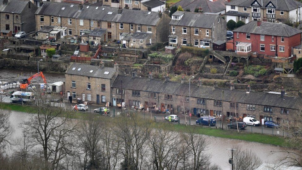 General view of properties that were flooded as residents begin clearing up following severe flooding beside the River Calder