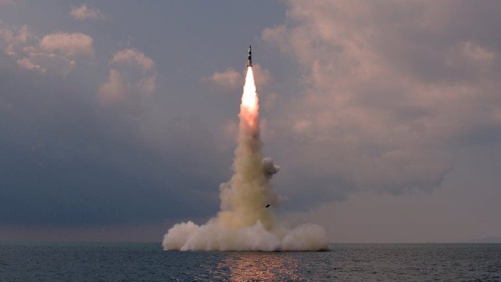 A photo published Oct. 19 by KCNA apparently showing a test of a new ballistic missile launched from a North Korean submarine