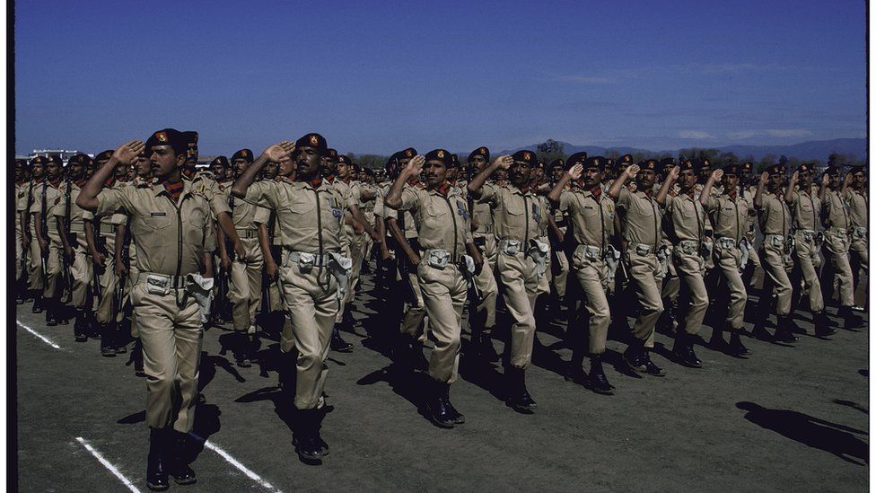 Ceremonial troops saluting during Pakistan National Day military parad