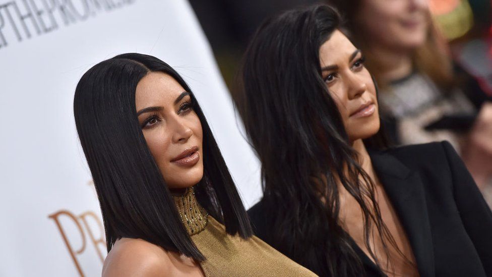 Kim Kardashian and Kourtney Kardashian arrive at the Premiere of Open Road Films' 'The Promise' at TCL Chinese Theatre on April 12, 2017 in Hollywood, California