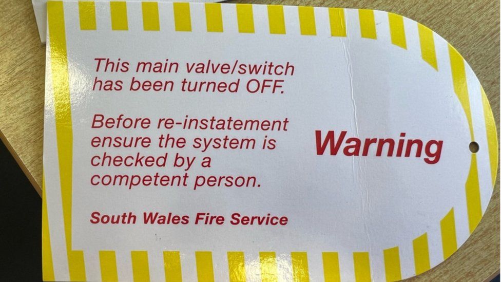 Warning tag from south wales fire service