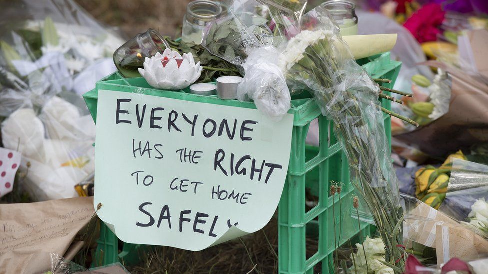 A sign left among tributes to murdered student Aya Maasarwe reads 'Everyone has the right to get home safely'