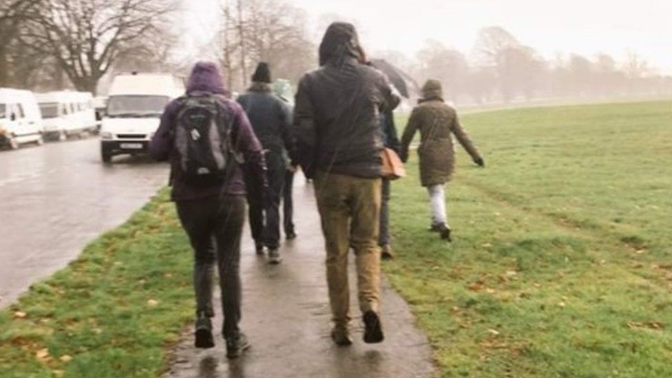 A group of walkers in the rain