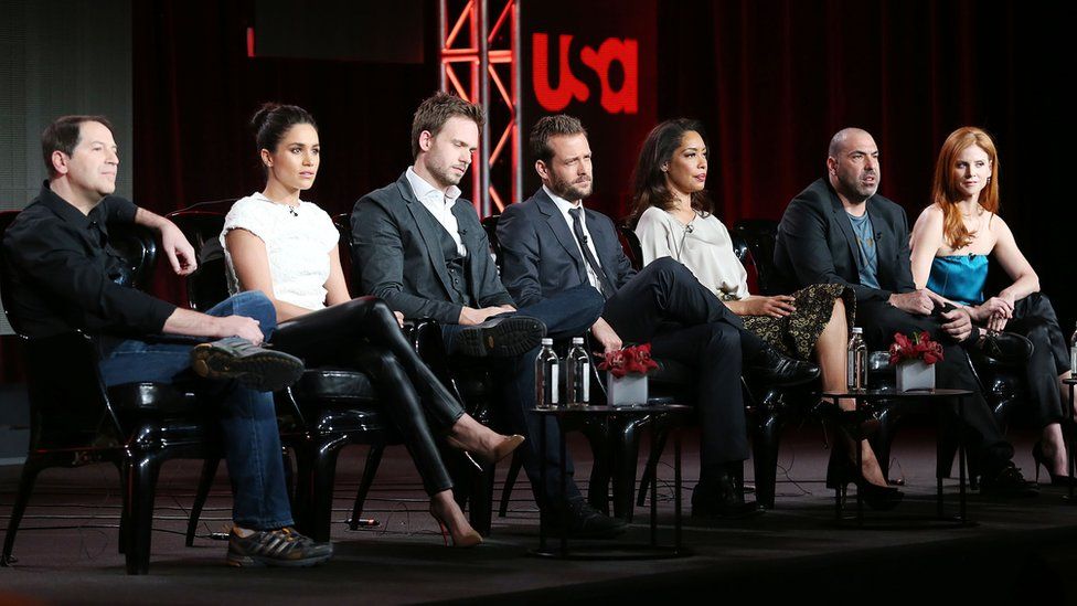 Ms Markle pictured with the Suits cast