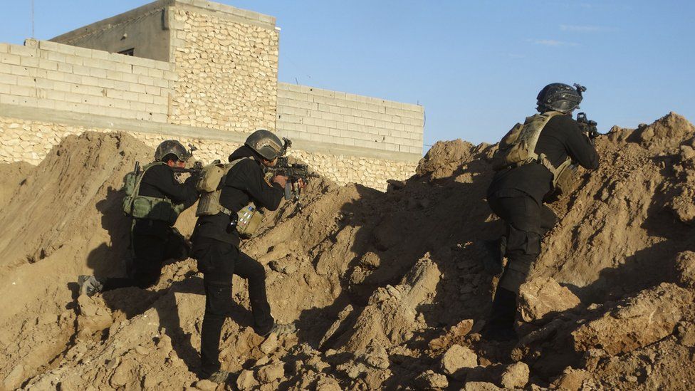 Iraqi security forces take combat position at the front-line with Islamic State group militants