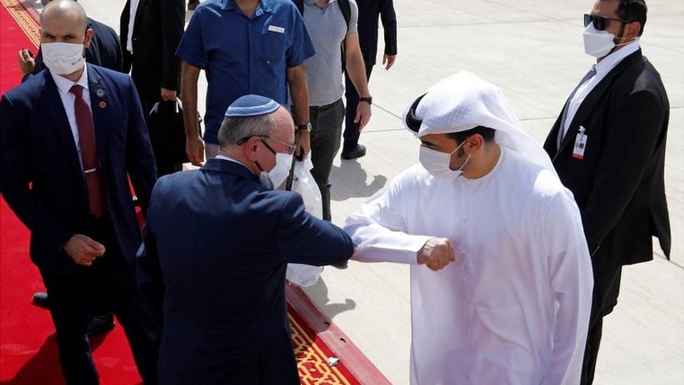 Israeli National Security Adviser Meir Ben-Shabbat elbow bumps with an Emirati official at Abu Dhabi airport in the United Arab Emirates (1 September 2020)