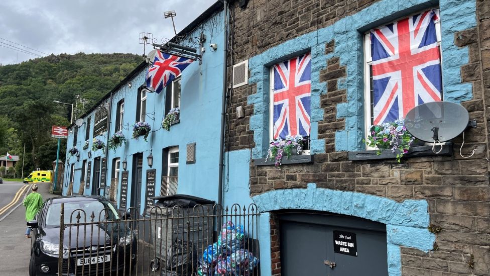 stone building covered in Union Jack flags