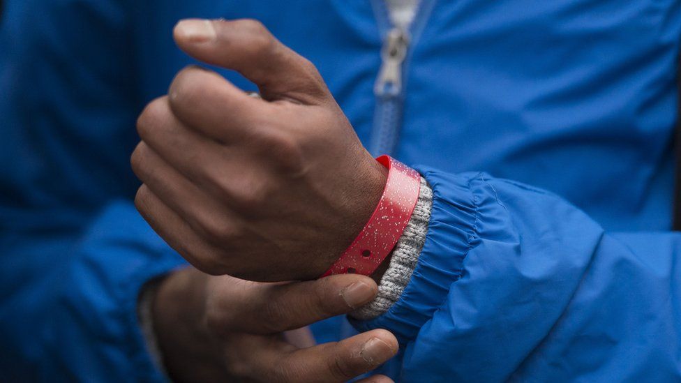 A wristband being worn by an asylum seeker