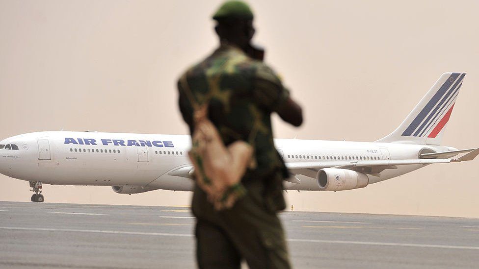 A Malian soldier watches as an Air France aircraft taxis at Bamako airport on March 29, 2012.