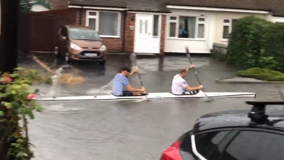 Kayakers on flood water in Chelmsford