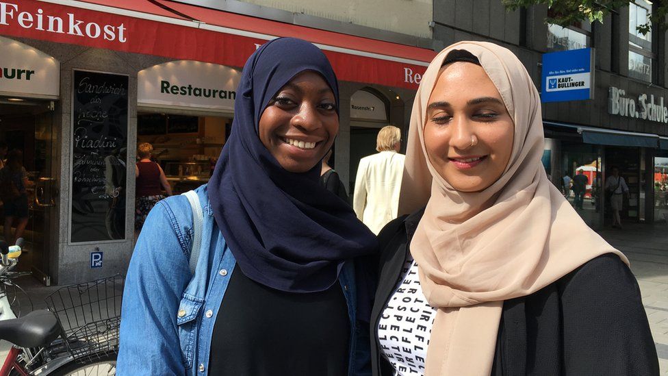 Kadidja (left) and her friend Nadia, photographed in Munich, both headscarf-wearing Muslim women