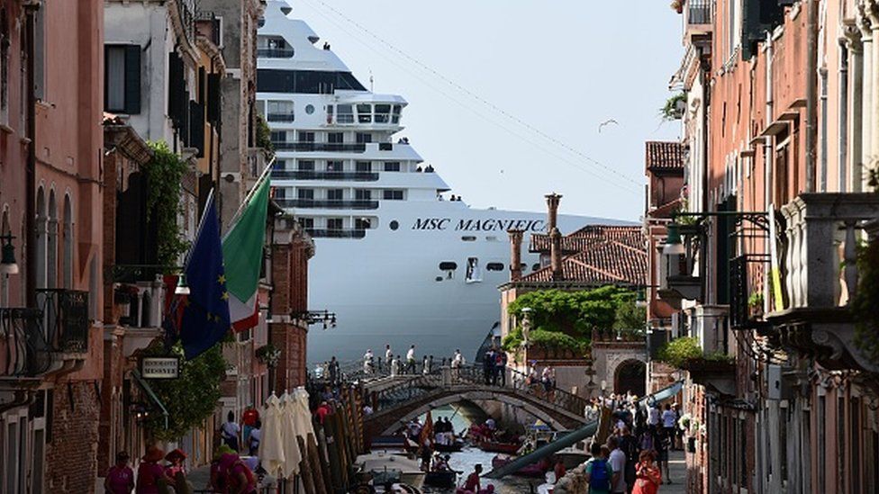 A cruise ship seen from a Venice canal